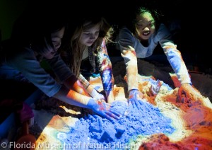 Children playing with the augmented reality sandbox