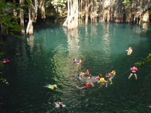 Students enjoy the cool waters of “cenote” Yokdzonot.