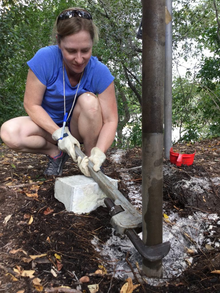 Dr. Andrea Dutton sets up a drill site.